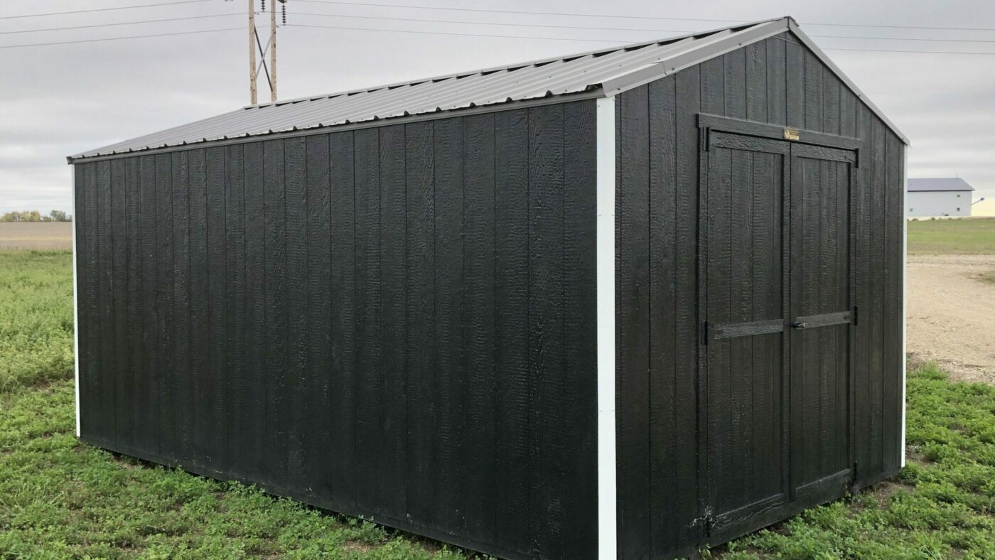 Black 10x12 shed in field
