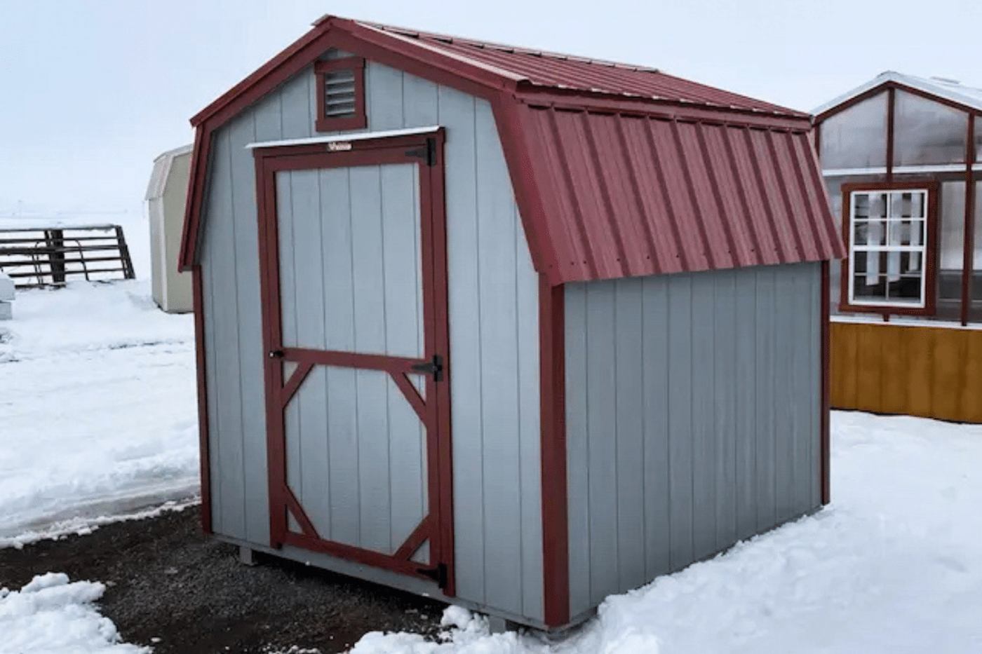 8x8 red and grey lo wall shed near snow