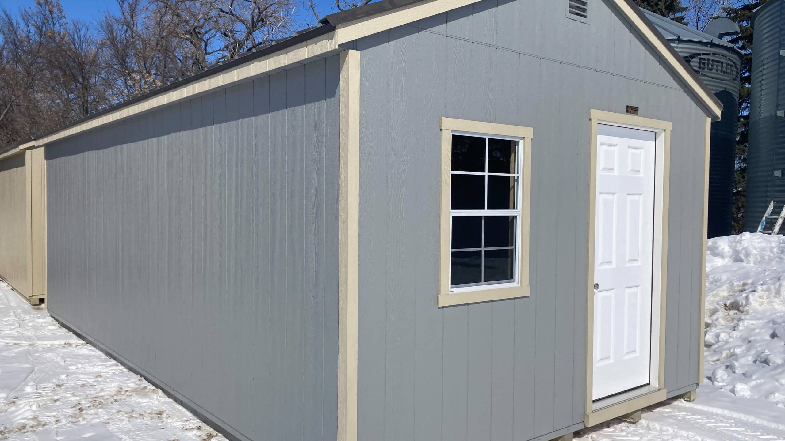 a frame garage shed with man door