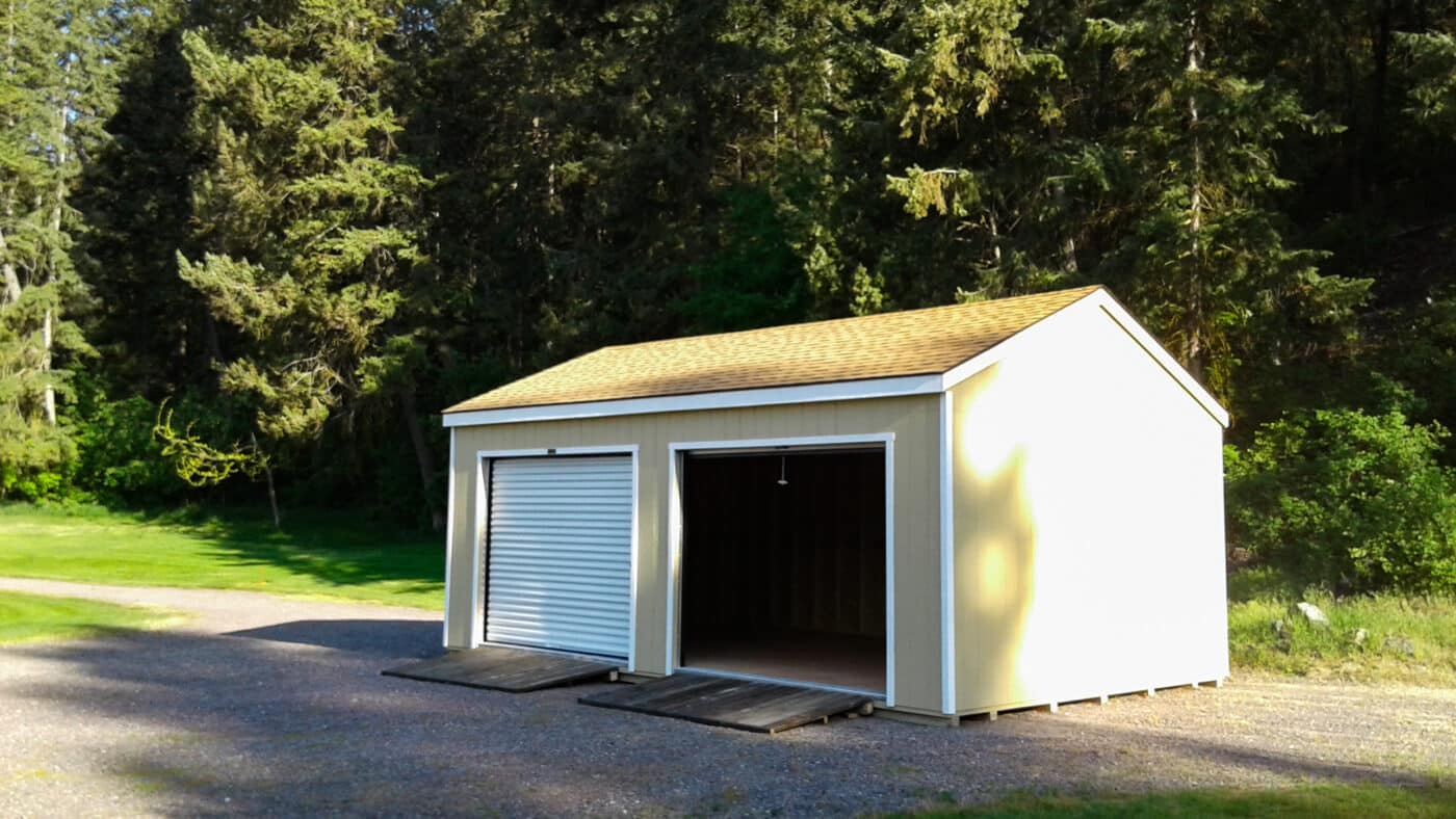 a frame garage with two garage doors