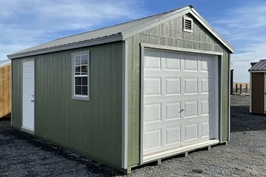 green garage with white side and overhead door in Surrey ND