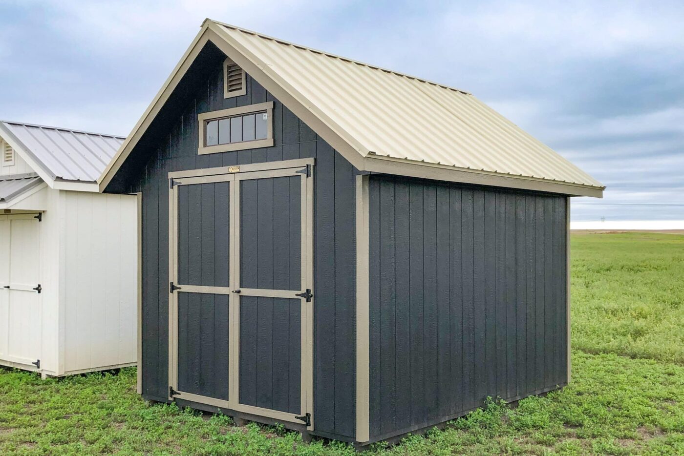 Gray 10x12 shed in field