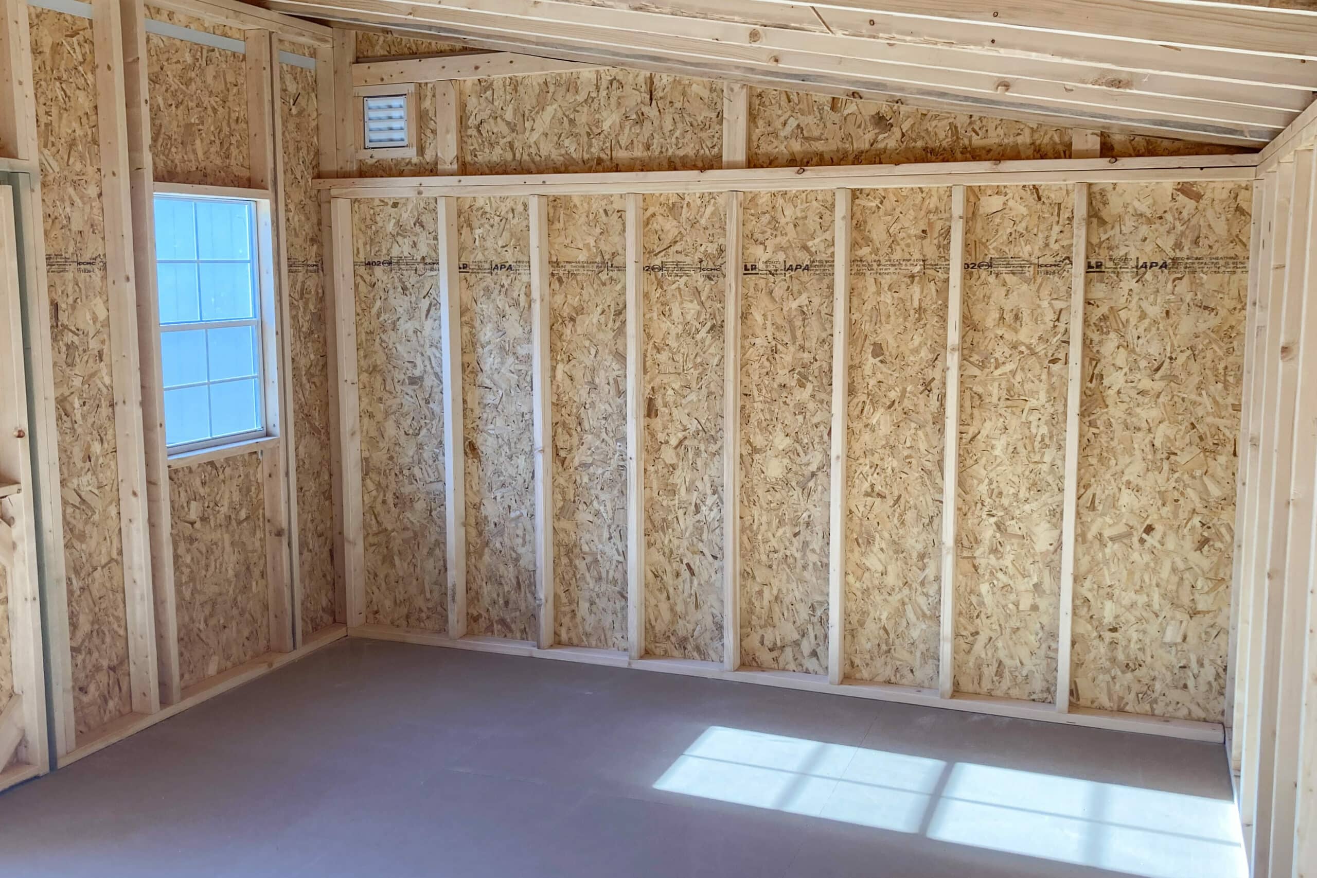 wooden shed interior with mono sloped roof